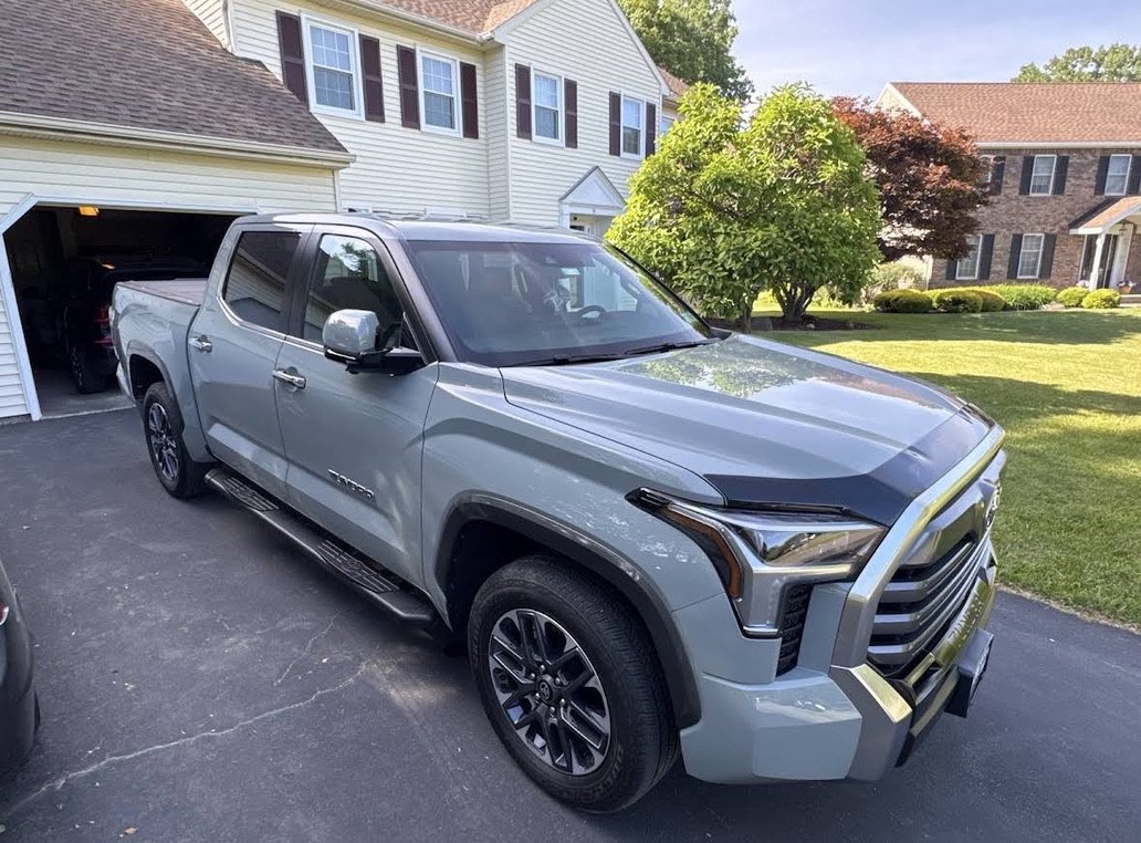 Black Toyota Tundra with a fresh ceramic coating in a driveway