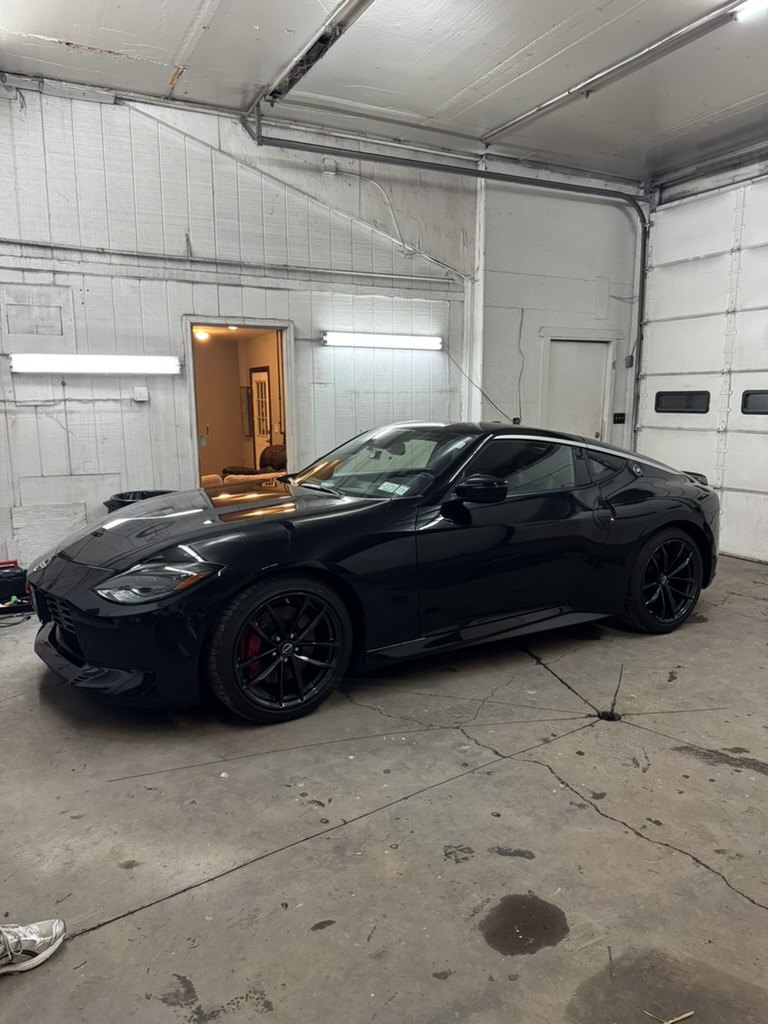 Black Nissan Z with dark window tint